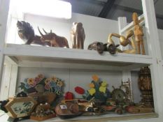 2 shelves of assorted wooden items including elephants,
