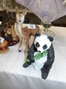 A faun group and a panda figure