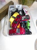 A small box of die cast cars