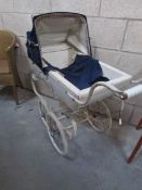 A Silver Cross dolls pram