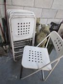 A set of 6 folding metal chairs