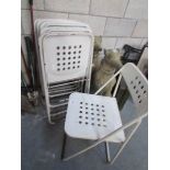 A set of 6 folding metal chairs