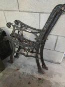 A pair of old cast iron bench ends