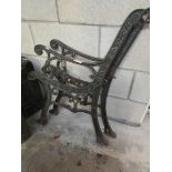 A pair of old cast iron bench ends