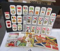 A collection of tea cards and reproduction cigarette cards