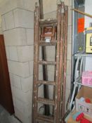 A triple extension wooden ladder