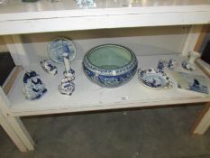 A blue and white planter and a quantity of blue and white Delft pottery