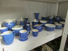 A shelf of blue motto ware pottery