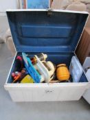 An old tin trunk containing mainly plastic toys