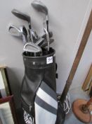 A set of Howson golf clubs and golf bag