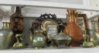 A shelf of miscellaneous including wall clock,