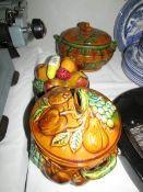 2 lidded tureens and a china fruit ornment