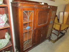 A bureau/cabinet with lead glazed doors,