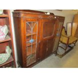 A bureau/cabinet with lead glazed doors,