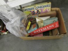 A box of interesting old games and a puppet