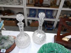 A pair of good quality cut glass decanters