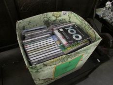 A box of assorted CD's