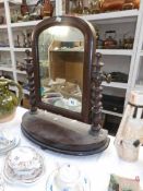 A mahogany toilet mirror