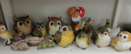 A shelf of owl figures,
