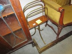 A Victorian magazine rack and a brass fender