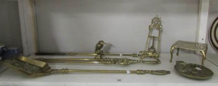 A mixed lot of brass ware including fire irons,