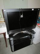 A flat screen television on stand