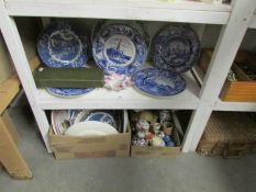 A shelf and 2 boxes of china including blue and white plates,