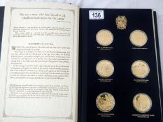 Presentation album of 24 gold-plated silver Churchill Centenary medals produced by the
