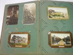 Postcards - An album of early postcards, topgraphical, comic, military,