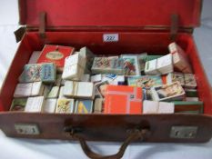 A large quantity of cigarette cards in a suit case