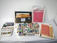 Stamps - A quantity of world stamps on loose sheets