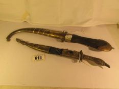 2 Middle Eastern brass sheathed daggers