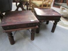 A pair of rustic coffee tables