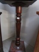 A good quality mahogany torchere