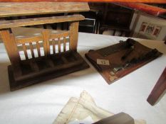 A pipe rack with brass plaque 'Smoke and be happy' and one other