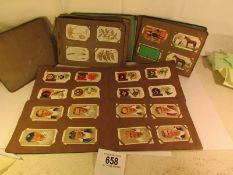 4 albums of assorted cigarette cards