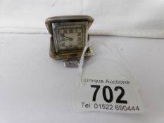 A small silver travel clock, Birmingham hall mark,