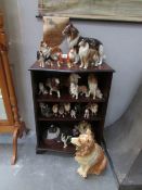 A large collection of collie dog figures