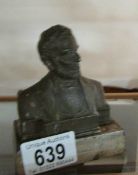 A desk bust of American President Abraham Lincoln, signed Dalouy,
