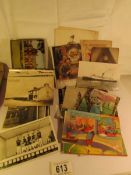 A mixed lot of old postcards and photographs