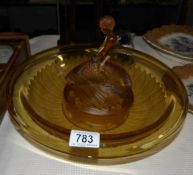 An art deco amber glass table centrepiece with a boy riding a fish