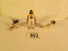 A silver and enamel penguin, a silver and enamel toucan and a silver rabbit in boot.