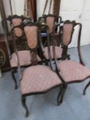 A set of 4 19th century cabriole leg dining chairs