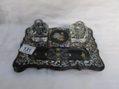 A pretty Victorian papier mache' ink stand decorated with gilt and mother of pearl