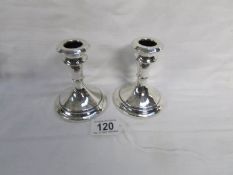 A pair of silver candlesticks