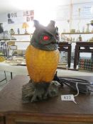 A bronzed cast iron Tiffany style owl table lamp with red jewelled eyes
