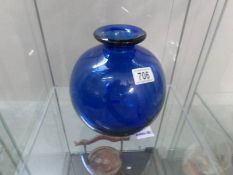 A blue glass vase marked Etling France