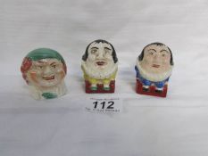 A pair of hand painted Humpty Dumpty salt and pepper pots together with a small money box