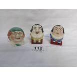 A pair of hand painted Humpty Dumpty salt and pepper pots together with a small money box