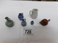 A small collection of miniature pots